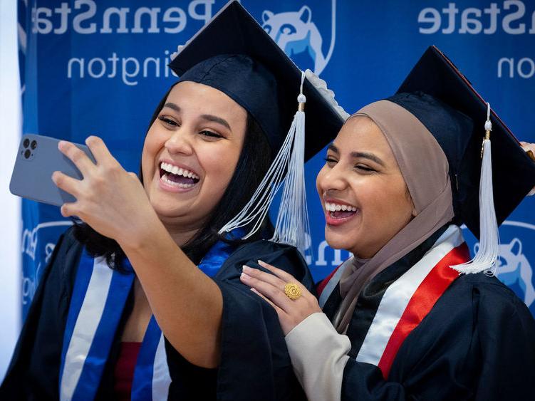 Two new Penn State Abington graduates take a selfie